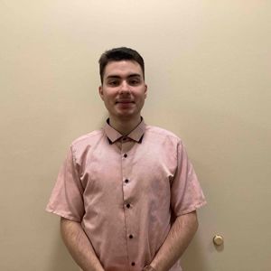 a man wearing a pink shirt